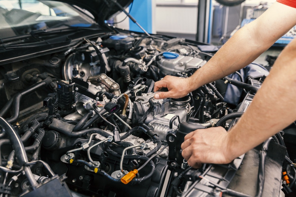 mechanic working on engine