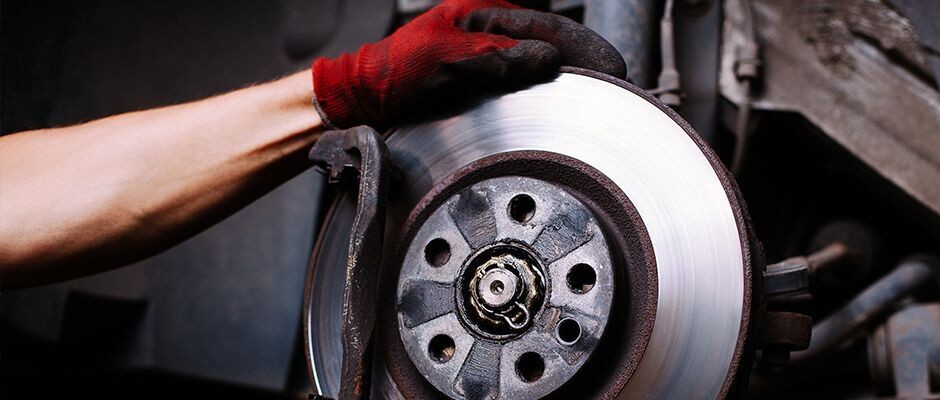 mechanic repairing brakes